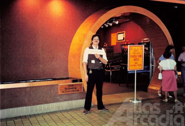Store manager, Jim Ferguson, holds location sign in front of Barrel of Fun #30 storefront in Prince of Orange Mall, Orangeburg, SC
