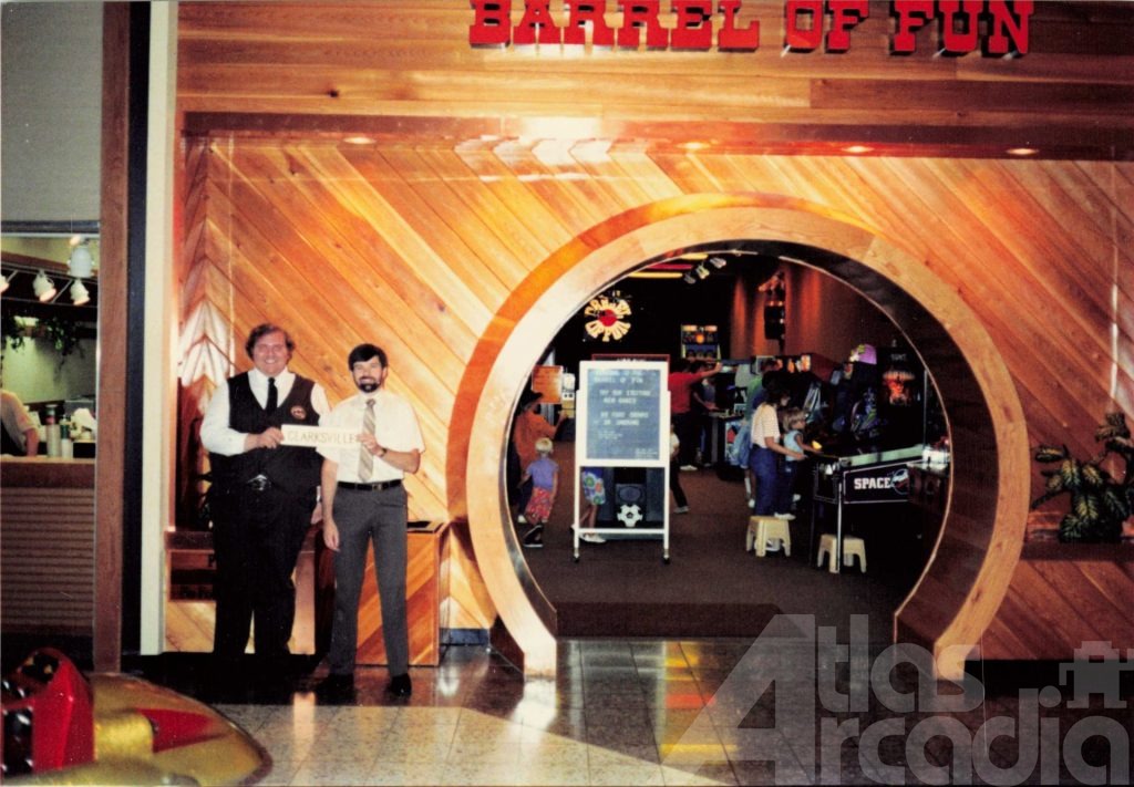 Storefront view of Barrel of Fun #03, Governor's Mall, Clarksville, TN in 1987 with two employees in front