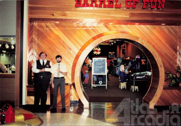 Storefront view of Barrel of Fun #03, Governor's Mall, Clarksville, TN in 1987 with two employees in front