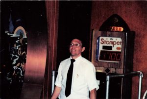 Barrel of Fun Winter Haven Mall employee, Dicky Adams in front of Stomper game