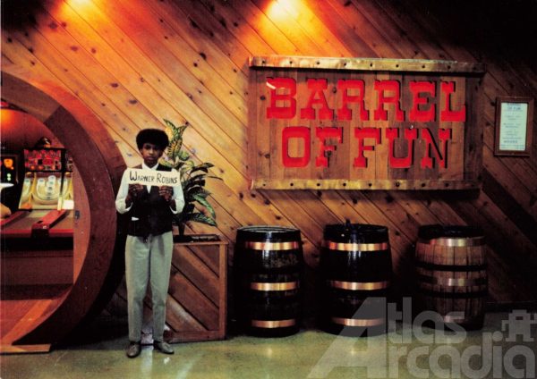 Employee Brenda Hickey stands in front of Barrel of Fun #08 storefront in Houston Mall, Warner Robins, GA circa 1987