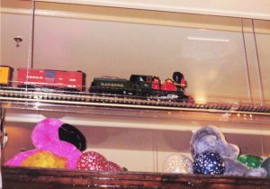 Toy train going around the ceiling at Commander Ragtime's, Barrel of Fun #13