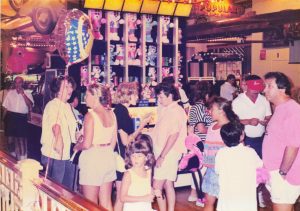 Crowd standing near Water Race game in Commander Ragtime's, Barrel of Fun #13
