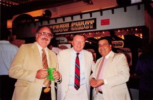 Bob Snow and Satish Bhutani pose with another man at the Grand Opening of Commander Ragtime's, Barrel of Fun #13