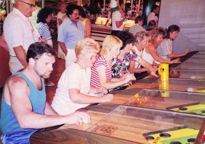 Customers playing Horse Race Roll Down game at Barrel of Fun #13, Commander Ragtime's