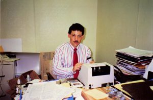Employee John Parker performs the opening money count in the office of Barrel of Fun #13, Commander Ragtime's