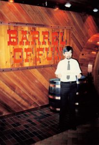 Employee stands in front of Barrel of Fun #14 in University Mall, Tuscaloosa, AL