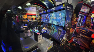 Halo: Fireteam Raven arcade cabinet with twin screens and gun controls, among other arcade games