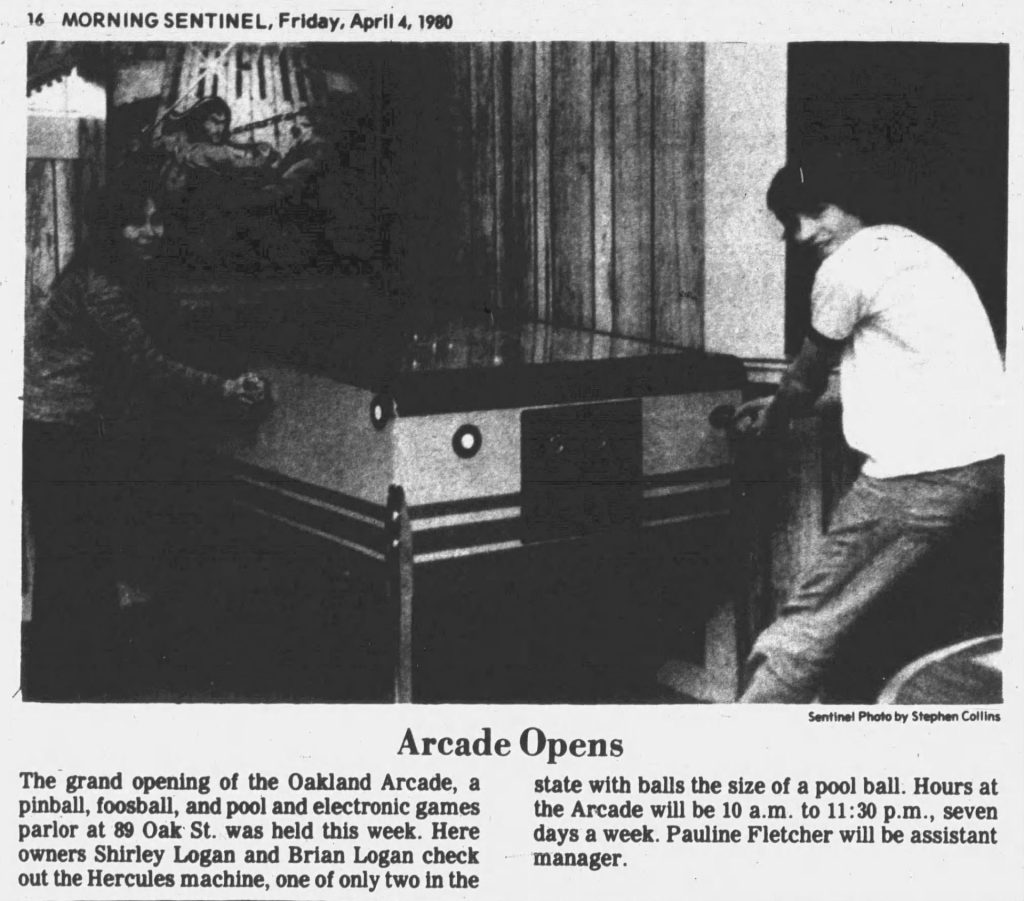 Owners Shirley and Brian Logan pose by their Hercules pinball machine for the Oakland Arcade's grand opening in this Morning Sentinel newspaper article