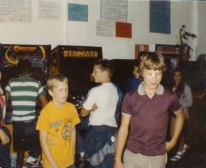 Interior of Tiffany's ice cream parlor and arcade, kids in front of arcade games